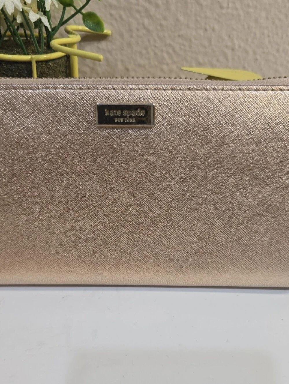kate spade metallic rose gold zip-around continental wallet